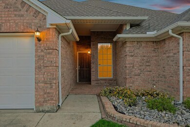 Exterior entry at dusk featuring a garage