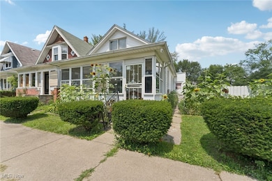 View of front of home featuring a sunroom