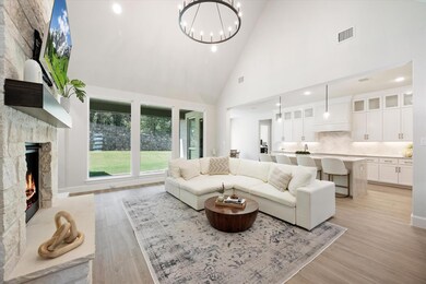 This open-concept living area boasts a stunning hi