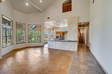 Unfurnished living room with a high ceiling, heal