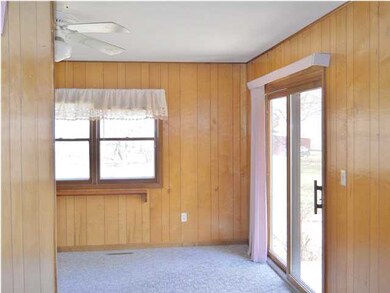 Sliding glass doors to small deck
