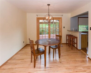 Hardwood flooring continued into the dining room j