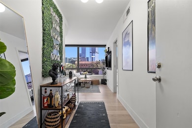 Hall with a skyline view, light wood-type floorin
