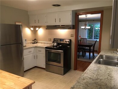 Fresh white kitchen with new appliances and counte