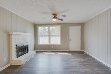New Hardwood Flooring and painted brick fireplace! 