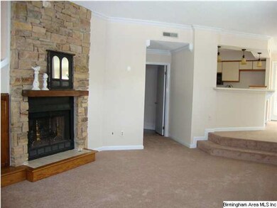 Living room with fireplace -- doorway leads to the