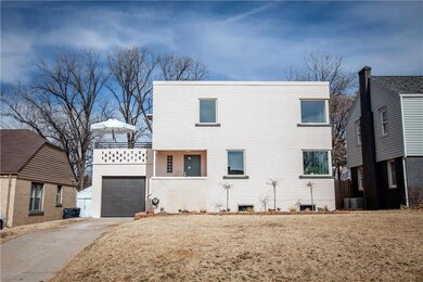 Fresh, designer exterior paint (Soft Shoe Pink Base, Black Forest Trim, Magnolia Luxe Door).