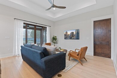 Living area with light wood finished floors, base
