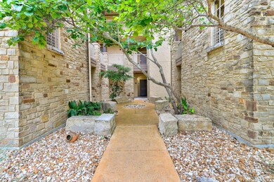 Doorway to property featuring stone siding
