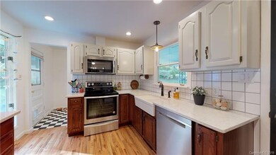 Beautiful white kitchen with hardwood floors