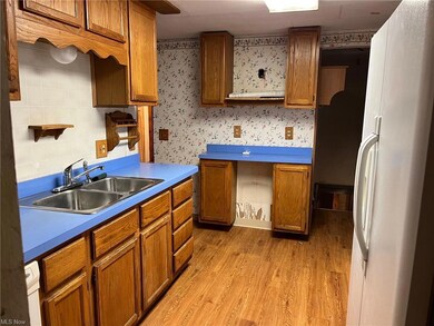 kitchen also provides entry to back yard and basem