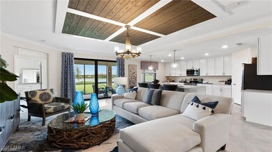 Living room with a chandelier, recessed lighting,