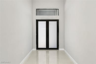 Doorway to outside with marble finish flooring