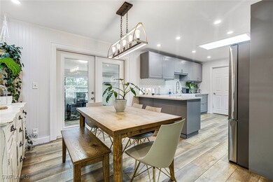 Dining area with recessed lighting, crown molding,