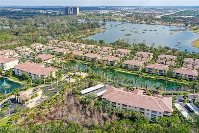View of property location with a large body of water and nearby suburban area
