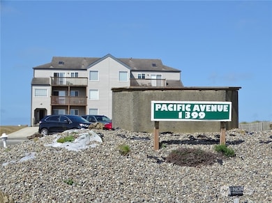 Front of the Sign and Building.