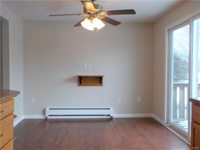 Dining Area with sliding glass door leading to the deck. Gas line on deck for gas grill.