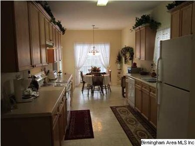 Well equipped eat in kitchen with private walk out