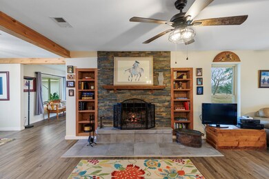 Living room with plenty of natural light, wood fi