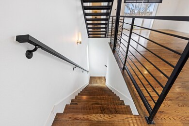 Architectural highlights include steel staircase a