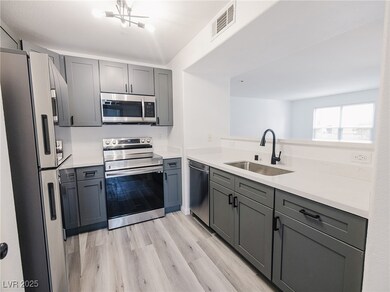 Kitchen with appliances with stainless steel finis