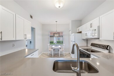 725 Saratoga Cir unit 102, Naples, FL 34104 - photo 7