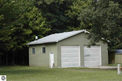 Summer pic of garage before home put on Lot