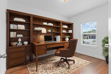 The spacious hallway leads directly into the dedicated home office tucked away for total privacy!  Featuring a large window and soaring ceilings, this private workspace is perfect for remote work, reading, or creative pursuits. *Virtually Staged***Image Representative of Plan Only and May Vary as Built**.