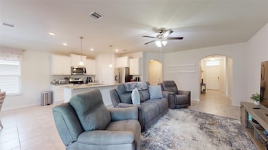 Tiled living room with ceiling fan