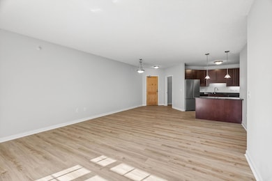 Open-concept layout with seamless flow from living room to kitchen and dining—ideal for modern living.