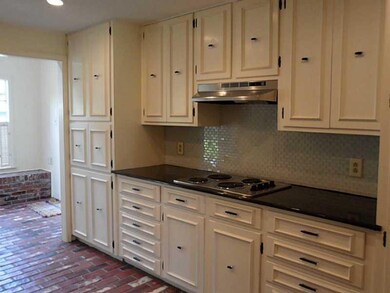 Kitchen. Stainless electric stovetop and hood and 