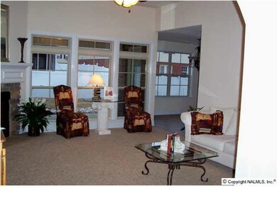 Similar Photo of Family Room. Gas Log Fireplace is an optional upgrade. Volume ceilings, smooth ceilings & walls plus rounded sheet rock corners and archways give the homes such an elegant look.