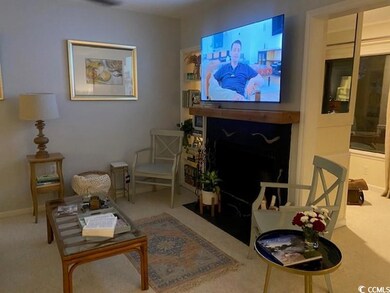 Living area with carpet floors and baseboards