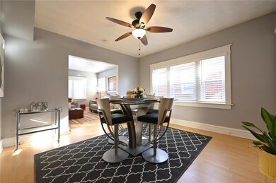 Dining room featuring light hardwood / wood-style floors, a healthy amount of sunlight, and ceiling fan