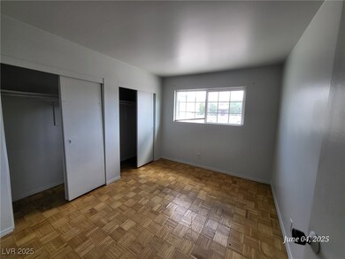 Unfurnished bedroom with multiple closets and base