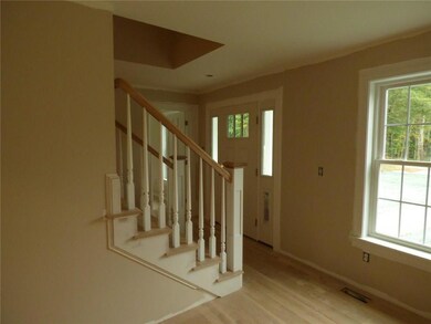 Front door and stairway from the...