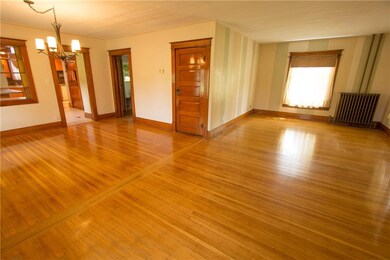 Dining room and kitchen have original, gleaming ha