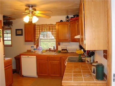 Kitchen. Nice med..honey tone cabnets..  Kitchen h