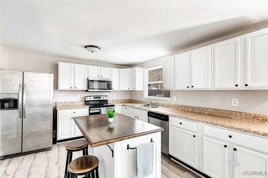 Kitchen with sink, a kitchen breakfast bar, white