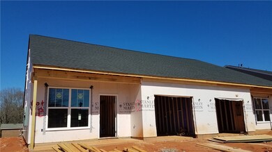 View back side of home with garage and back option