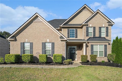Craftsman house featuring a front lawn and brick s