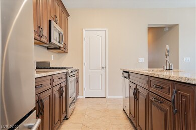 Island kitchen with granite counters, stainless st