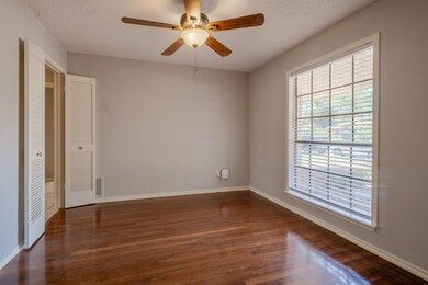 Unfurnished bedroom with a textured ceiling, a clo