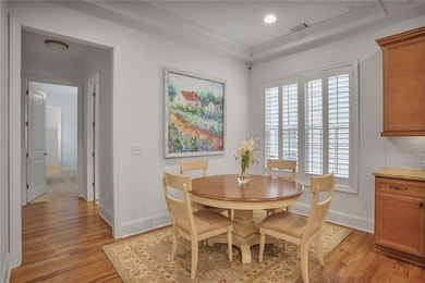Dining area featuring plenty of natural light, light wood-style floors, and recessed lighting