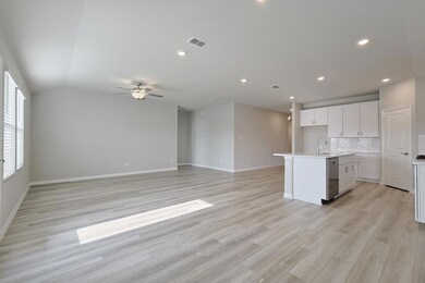 Perfect for entertaining family and friends, the living area is open to the kitchen.