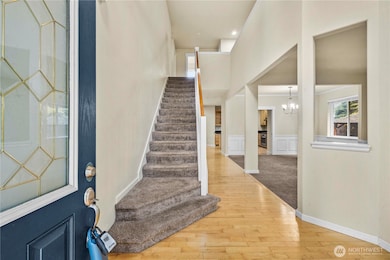 Elegant entry with views to the upper level.