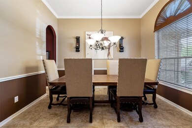Adorable formal dining which leads to the spacious kitchen!