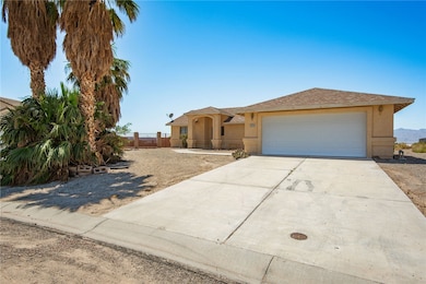 View of front of home with stucco siding, concrete