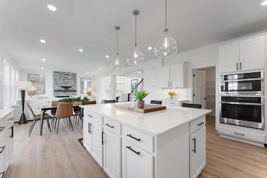 (Photo of a similar home, actual homes finished will vary) There is a walk-in pantry off the kitchen.