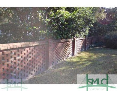 Exterior Back. Backyard lattice brick fence detail